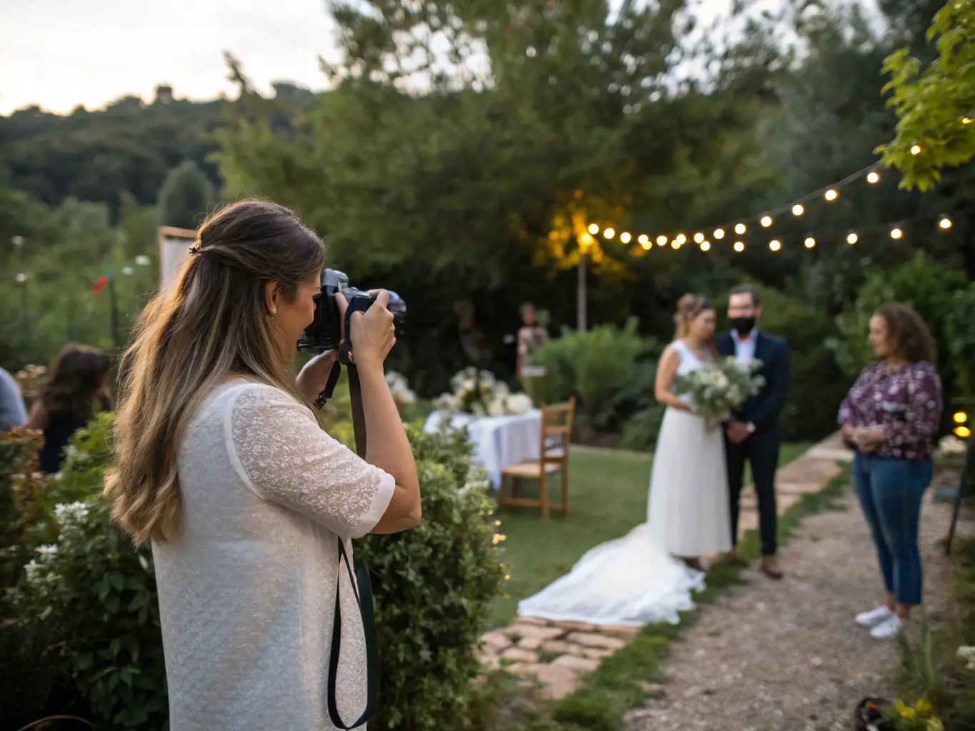 A wedding coordinator assisting a bride and groom during the ceremony with a calm and professional demeanor, representing Wedding Inspirations' wedding day coordination service.